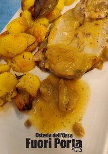 Trancio di coscia di maialino con patate novelle